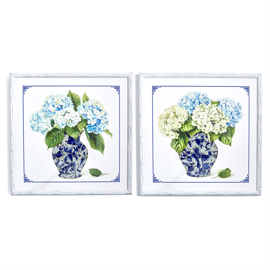 Two decorative tiles with blue and white floral designs on a white background