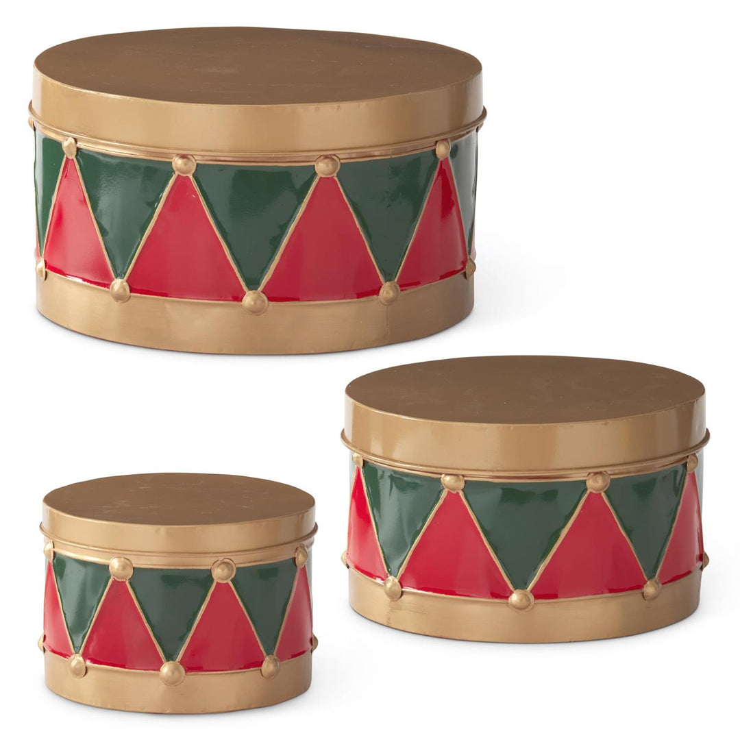 THREE VARYING SIZED METAL DRUMS WITH LIDS IN RED AND GREEN PATTERN AND LIDS CLOSED