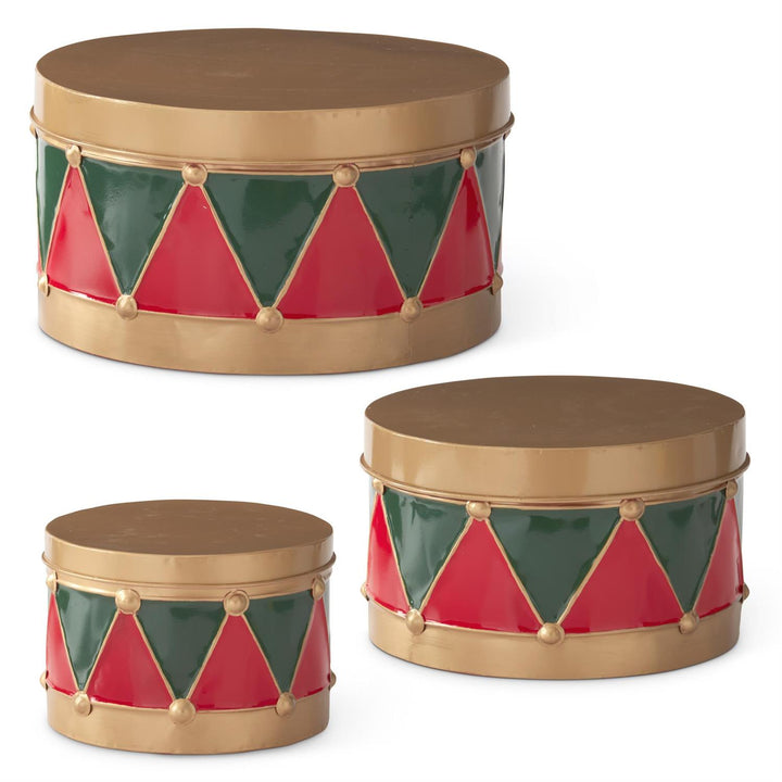 THREE VARYING SIZED METAL DRUMS WITH LIDS IN RED AND GREEN PATTERN AND LIDS CLOSED