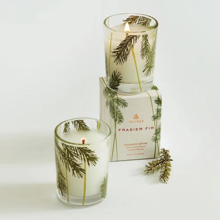 Frasier Fir pine needle votive candle shown in a styled holiday setting