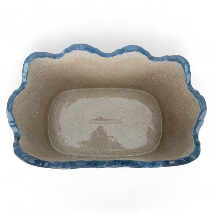 Rectangular pet bed with blue rim on a white background