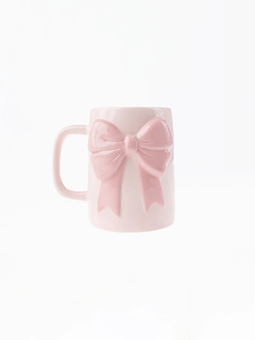 Pink mug with a bow on a white background
