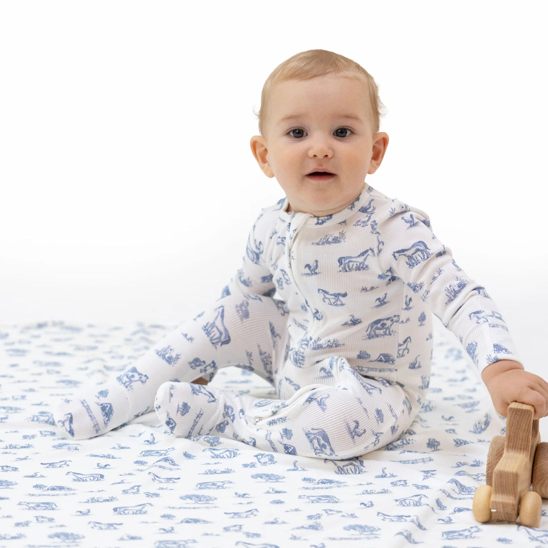 Angel Dear Farm Friends 2-way Zipper Footie worn by a baby in a lifestyle view highlighting the farm friends 2-way design