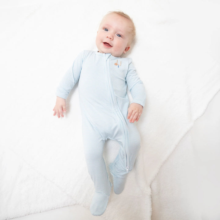 Angel Dear Football Blue Micro Stripe 2-way Zipper Footie worn by a baby in a lifestyle view highlighting the football blue micro stripe 2-way design