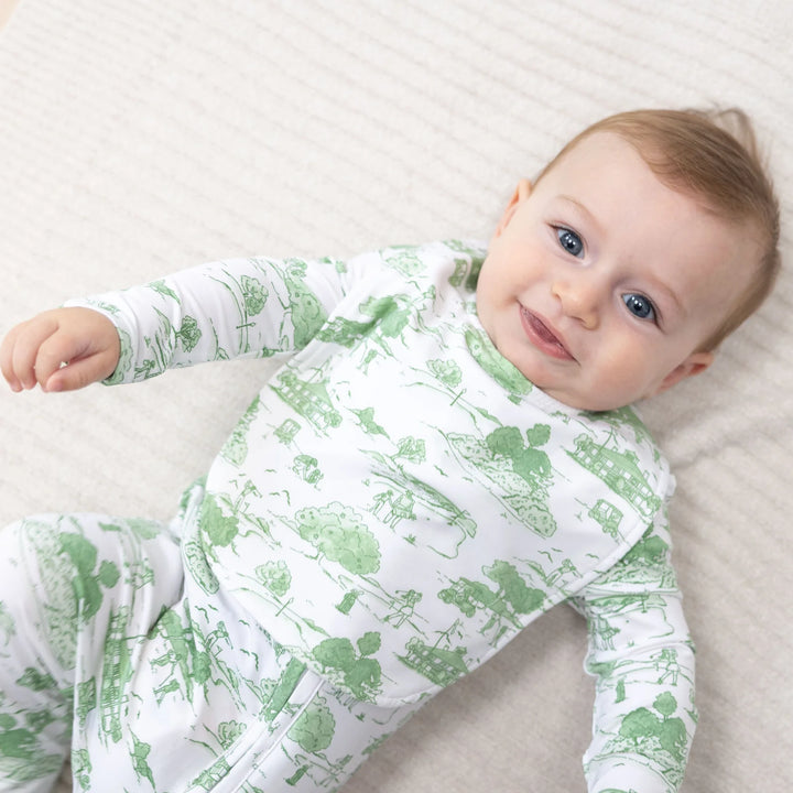 Angel Dear Golf Toile Green Feeding Bib worn by a baby in a lifestyle view highlighting the golf toile green design