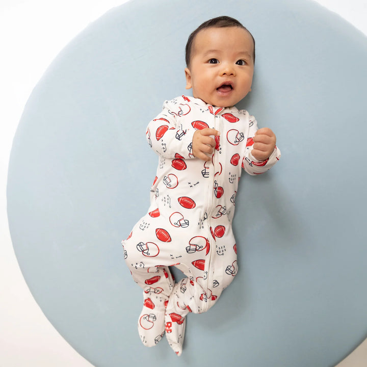 Angel Dear Touchdown Time 2-way Zipper Footie worn by a baby in a lifestyle view highlighting the touchdown time 2-way design