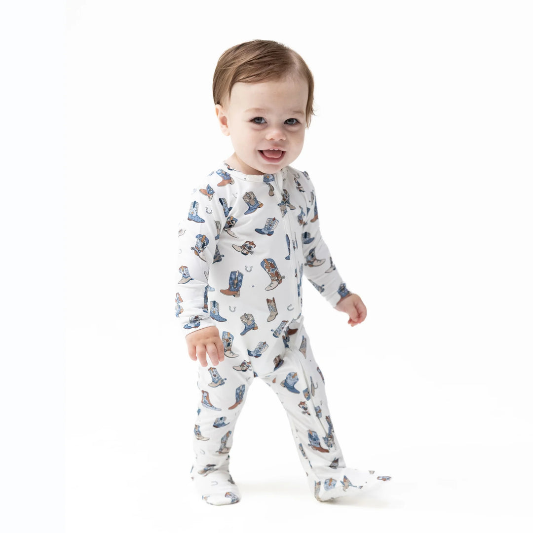 Angel Dear Buckaroo Boots 2-way Zipper Footie worn by a baby in a lifestyle view highlighting the buckaroo boots 2-way design
