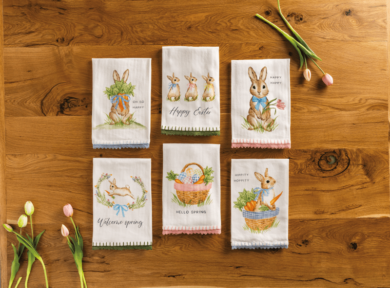 SIX EASTER AND BUNNY INSPIRED HAND TOWELS WITH CROCHET TRIM ON WOODEN TABLE BACK GROUND WITH TULIPS