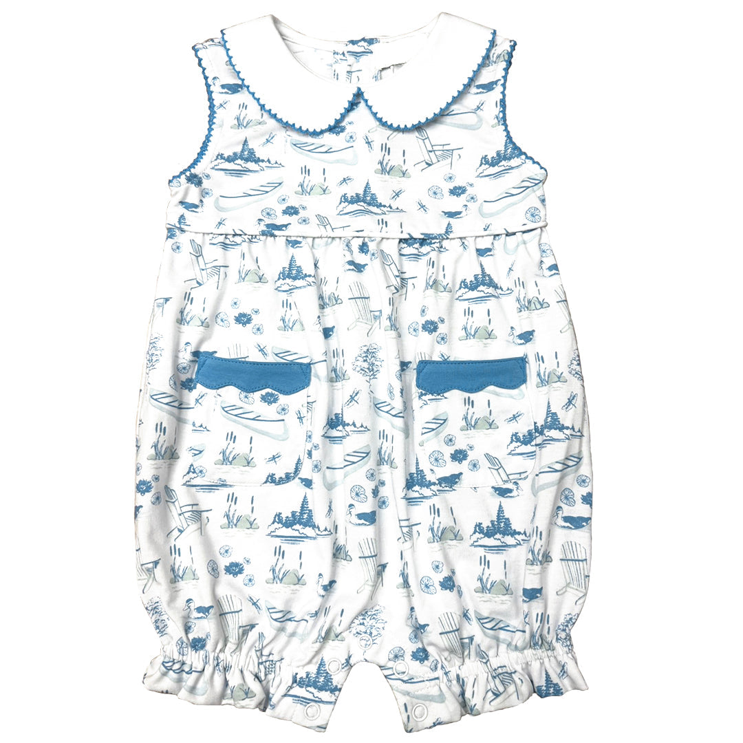 White romper with blue toile lake pattern on a white background