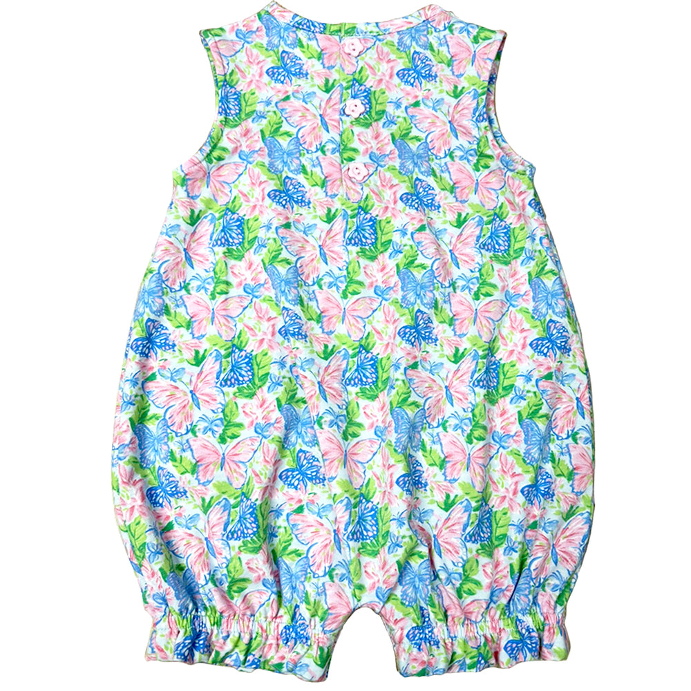 Colorful floral and butterfly patterned romper on a white background