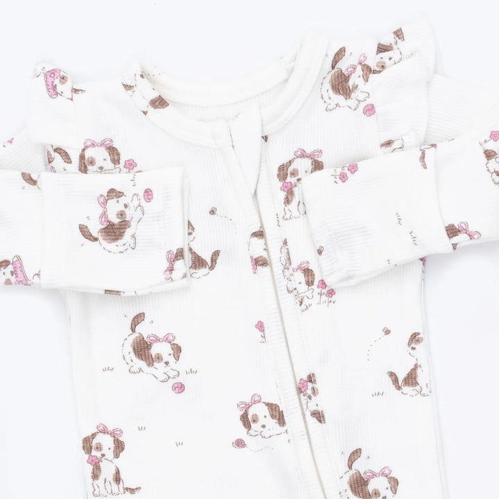 Angel Dear Explorer Puppy Pink 2-way Ruffle Sleeve Zipper Footie close-up of the baby footie highlighting the print, closures, and finishing details