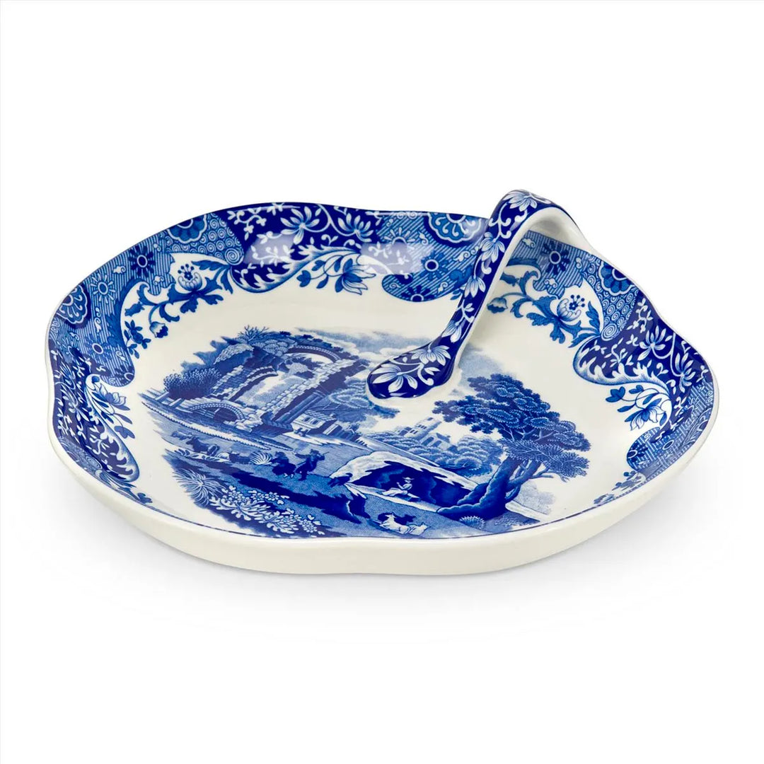 Blue and white decorative plate with a landscape design on a white background