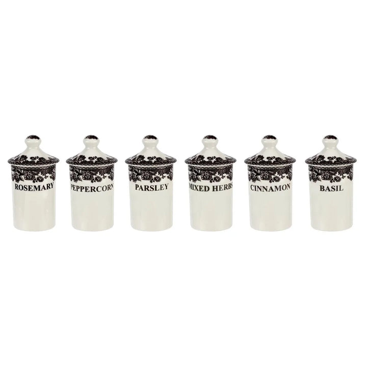 Set of six ceramic herb containers with black text labels on a white background