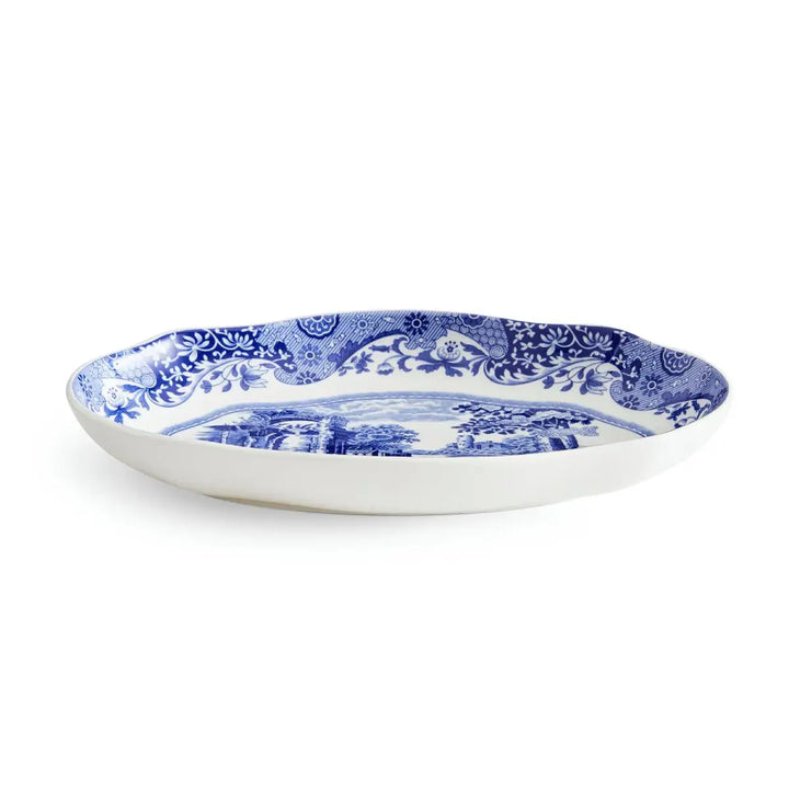 Blue and white decorative plate on a white background