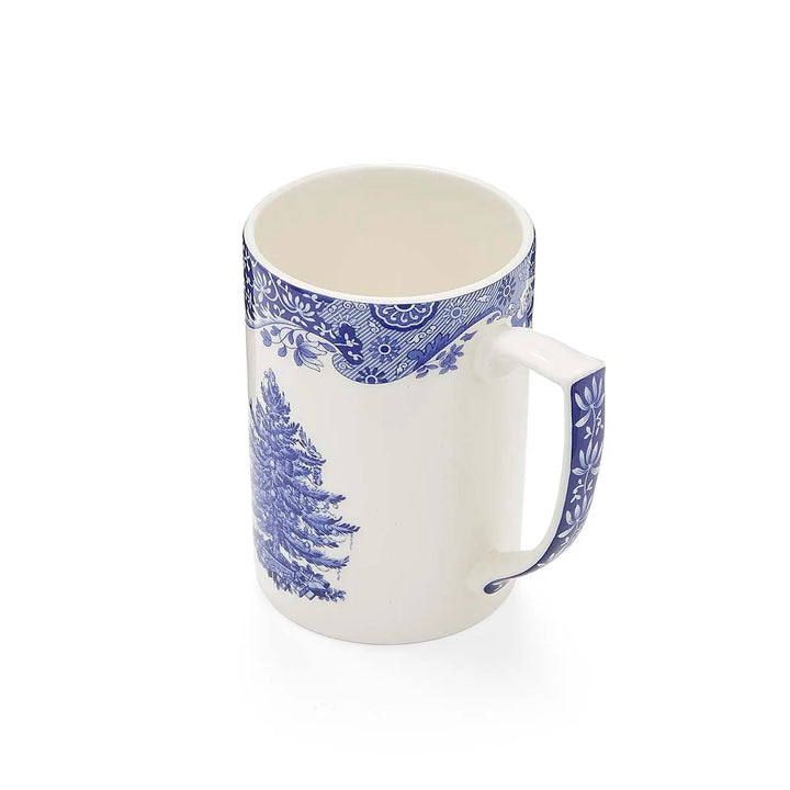 White mug with blue floral patterns on a white background