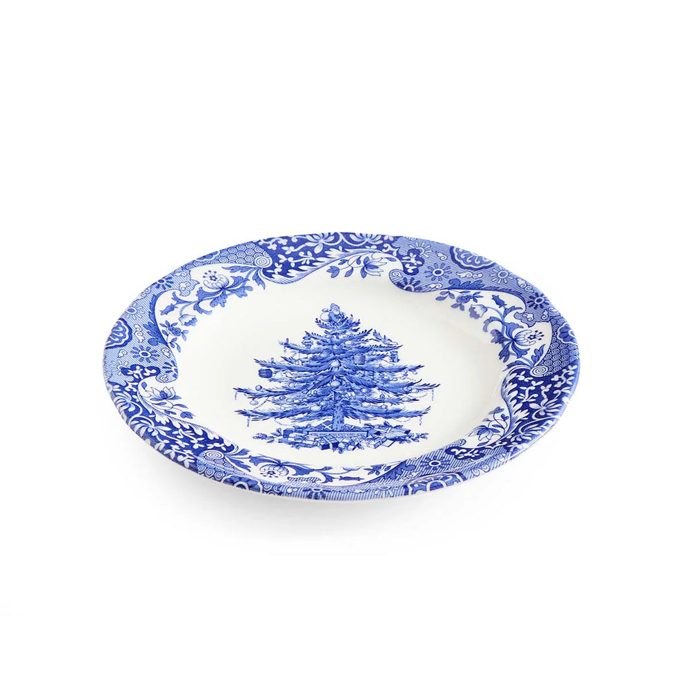 blue and white plate angled on white background