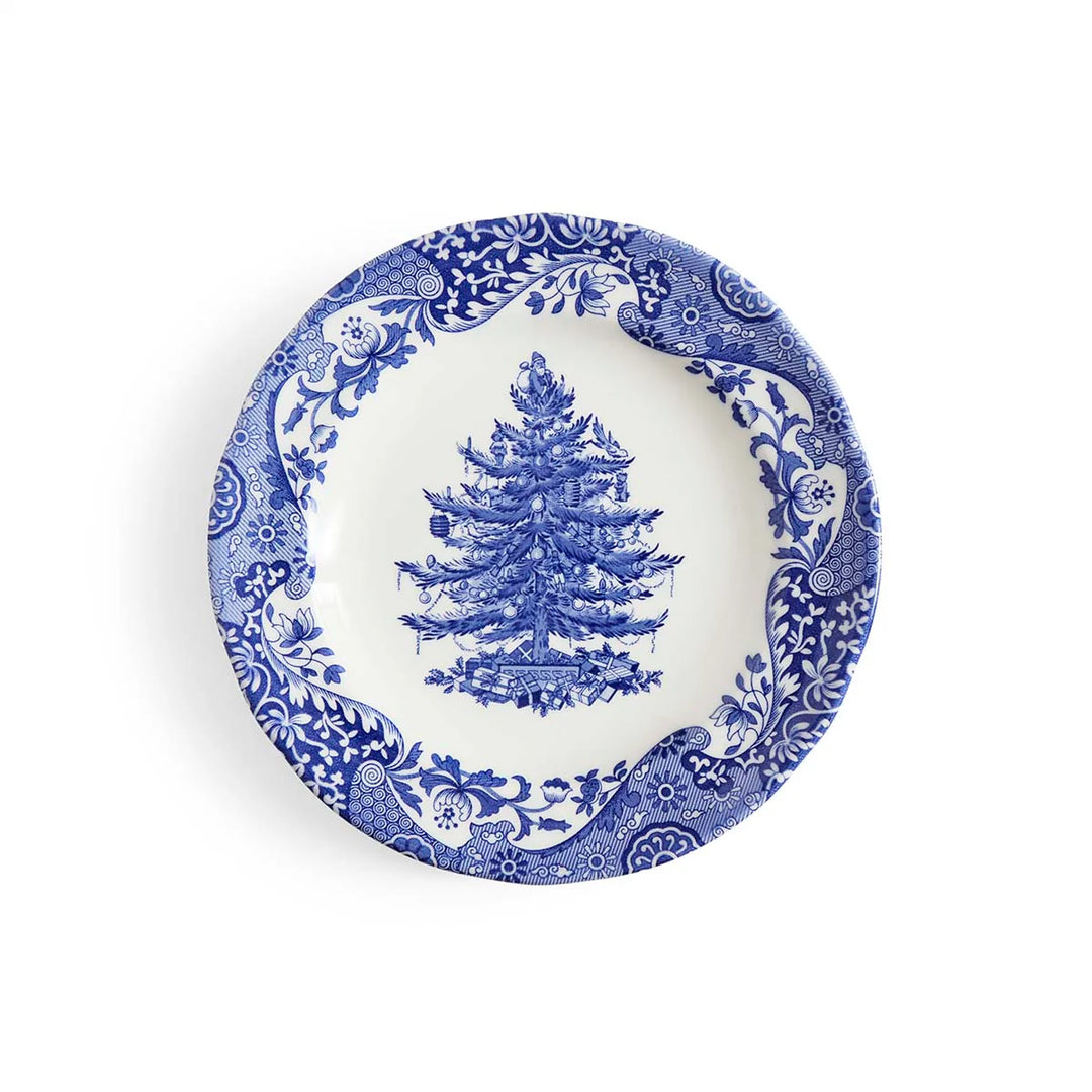 Decorative plate with blue floral border and central Christmas tree design on a white background