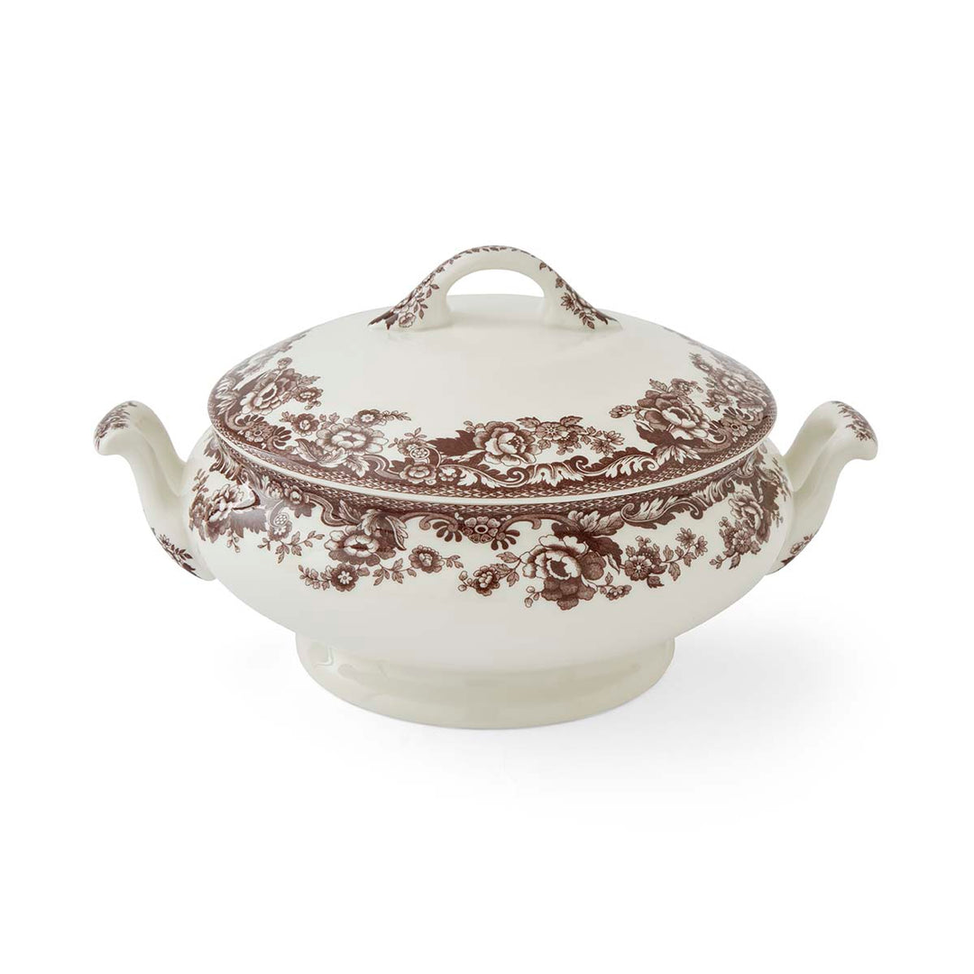 White ceramic tureen with brown floral pattern on a white background