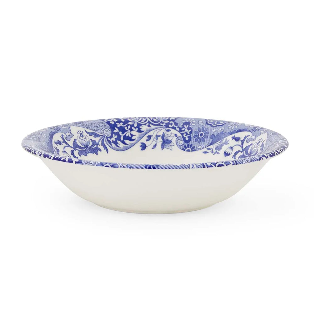 White bowl with blue floral pattern on a white background