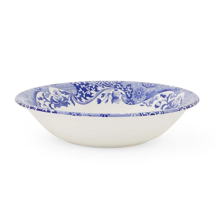White bowl with blue floral pattern on a white background