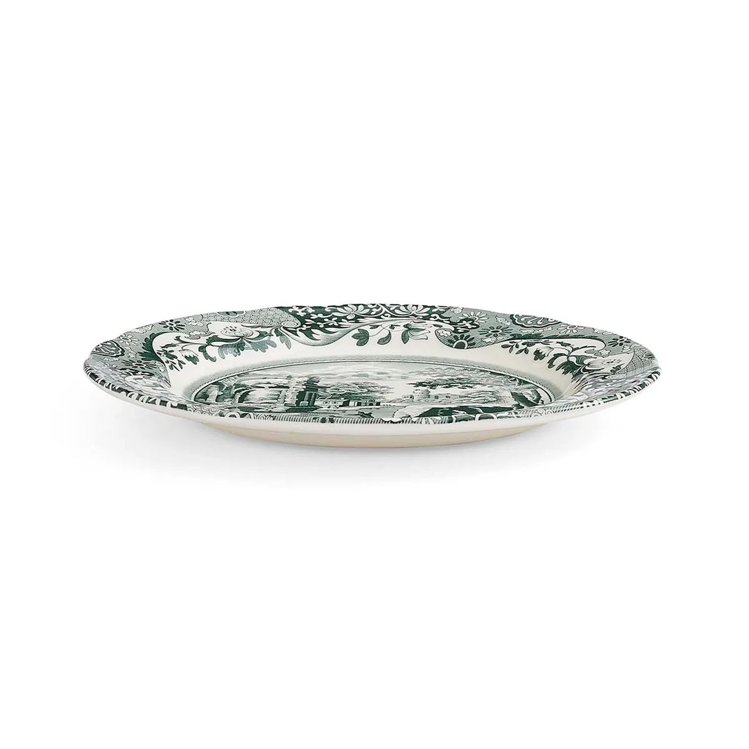 Decorative plate with green floral pattern on a white background