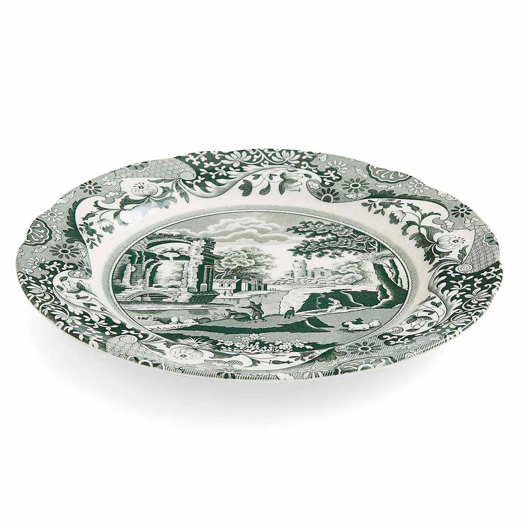 Decorative plate with green and white pattern on a white background