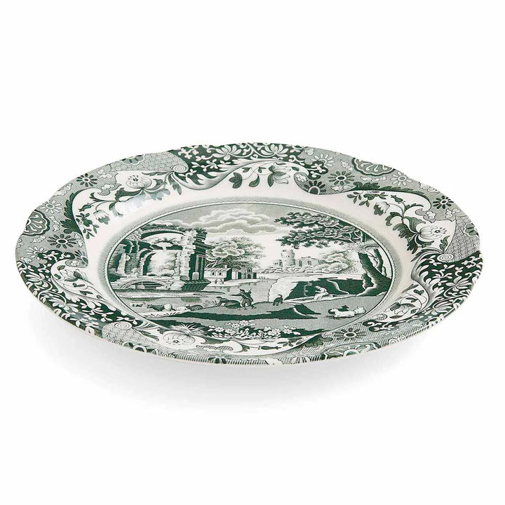 Decorative plate with green and white pattern on a white background