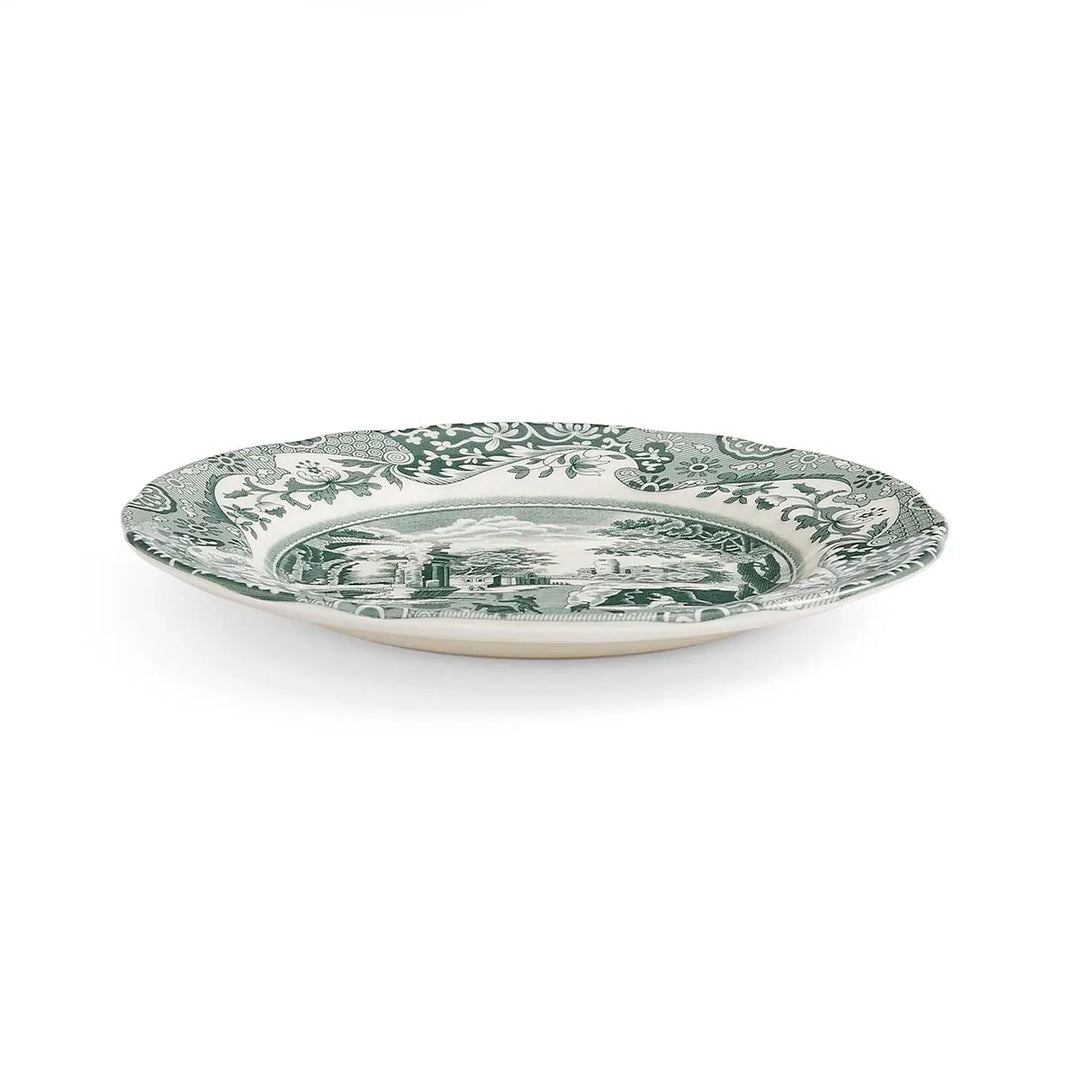 Decorative plate with green floral pattern on a white background