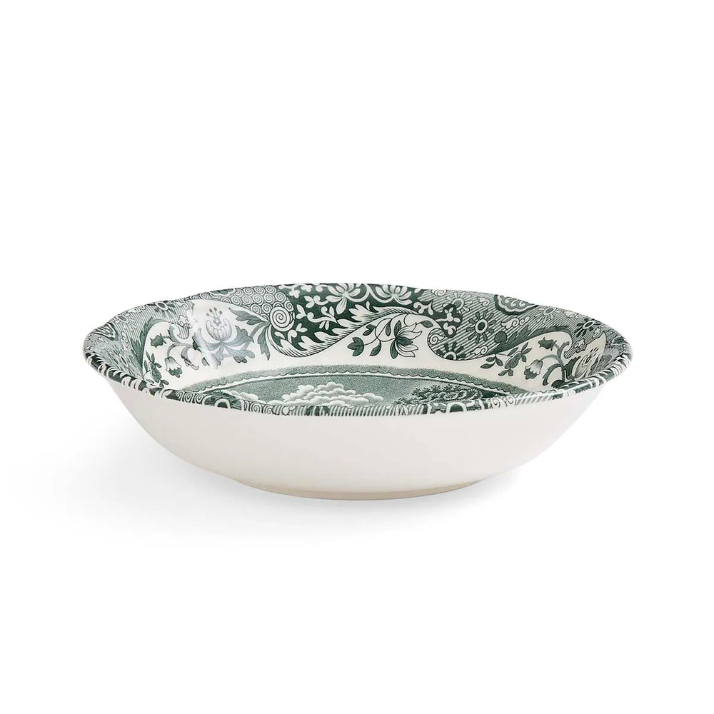 Decorative bowl with green floral pattern on a white background