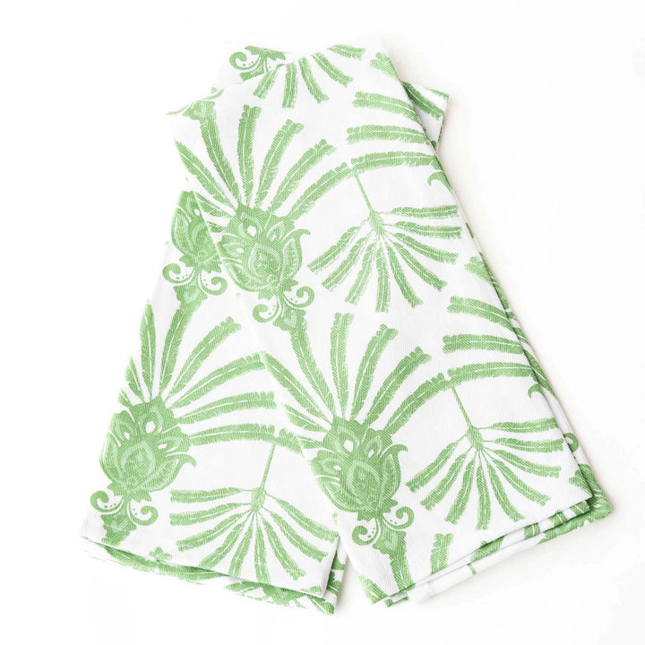 Green leaf patterned fabric on a white background