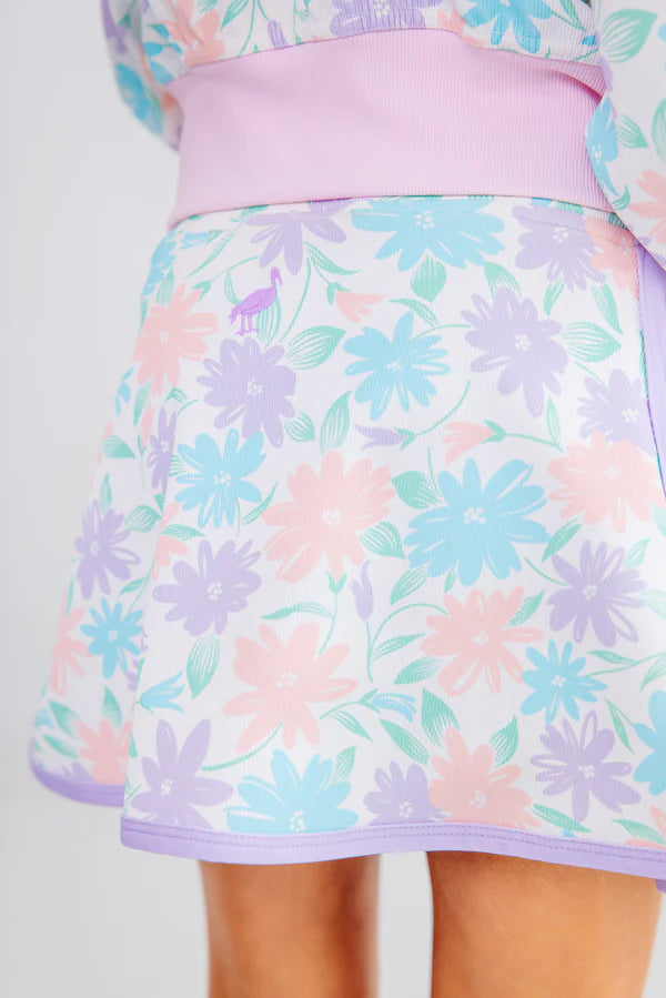 Pastel floral patterned skirt with a matching top on a white background