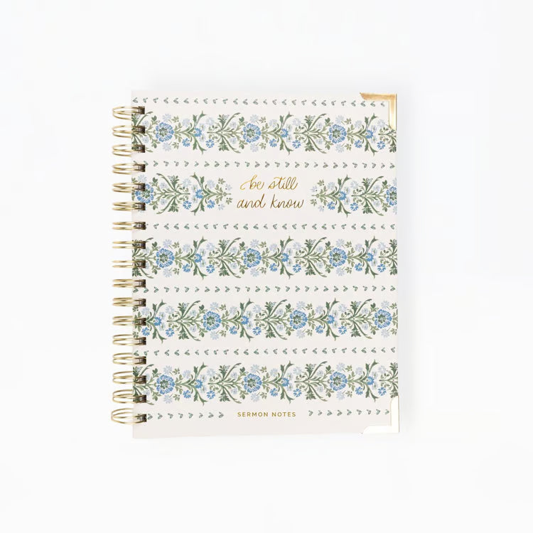 Notebook with floral design and text on a white background