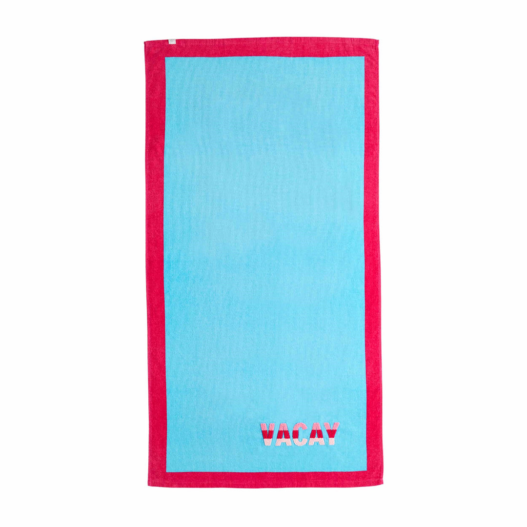 LIGHT BLUE TOWEL WITH HOT PINK BORDER. VACAY EMBROIDERED IN STRIPED RED AND PINK