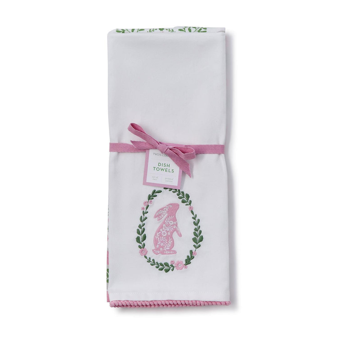 Set of two dish towels with floral designs and a pink bow on a white background