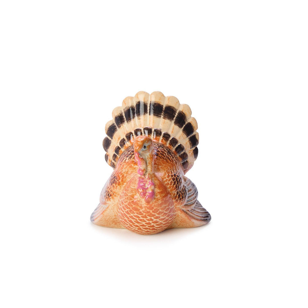 Decorative turkey figurine on a white background