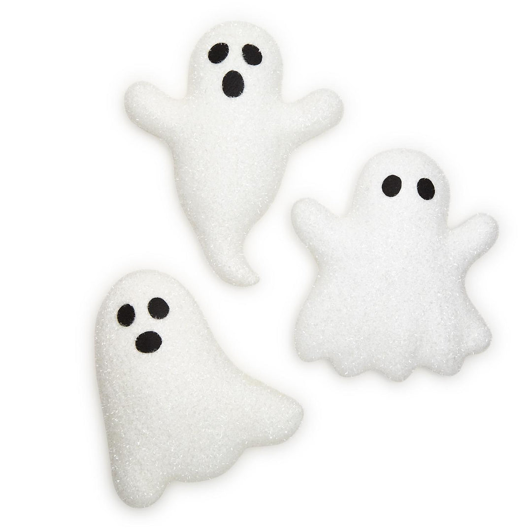 Three white ghost-shaped hanging decor with black eyes and mouths on a white background