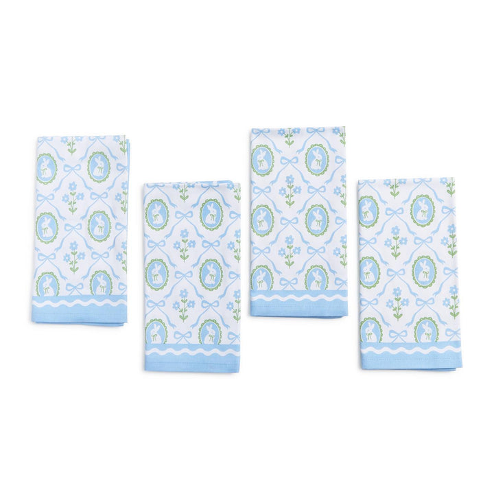 Set of four decorative towels with blue and green pattern on a white background