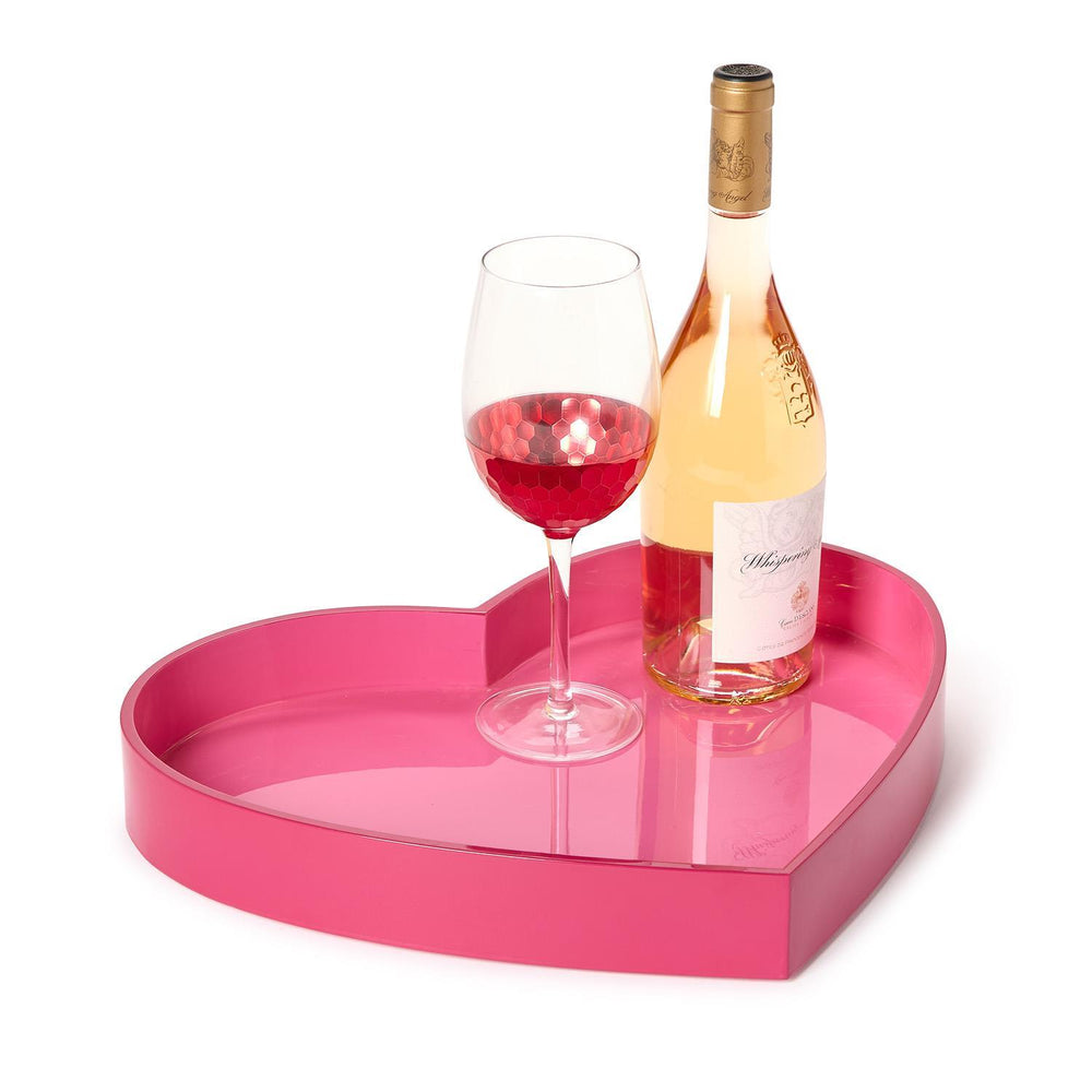 Heart-shaped tray with a bottle of wine and a glass on a white background