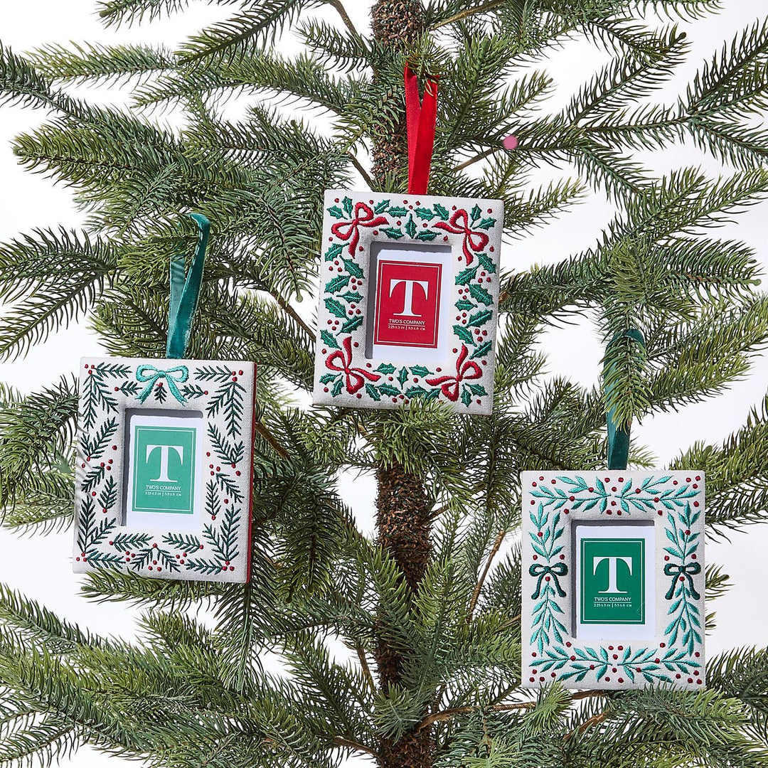 Decorative Christmas ornaments with letter 'T' on a tree