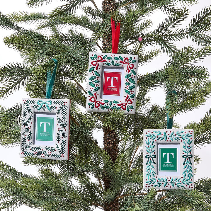 Decorative Christmas ornaments with letter 'T' on a tree
