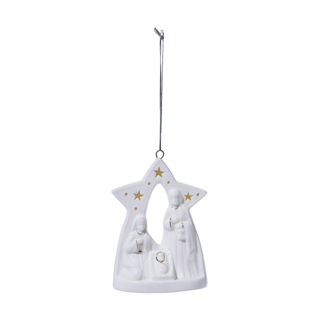 A white ceramic Christmas nativity ornament shaped like a star with gold stars and a silver hanging loop, shown against a plain white background.