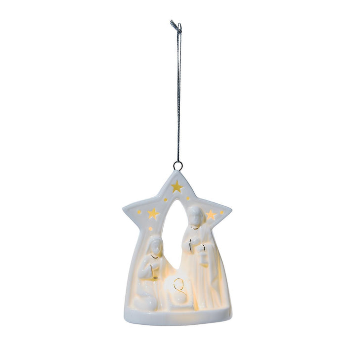 Decorative hanging nativity scene with stars on a white background