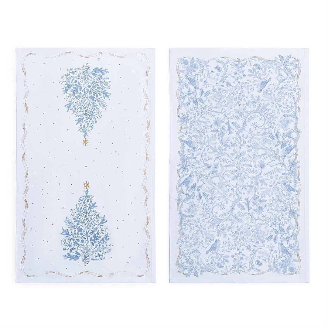 Two decorative paper sheets with Christmas tree designs on a white background