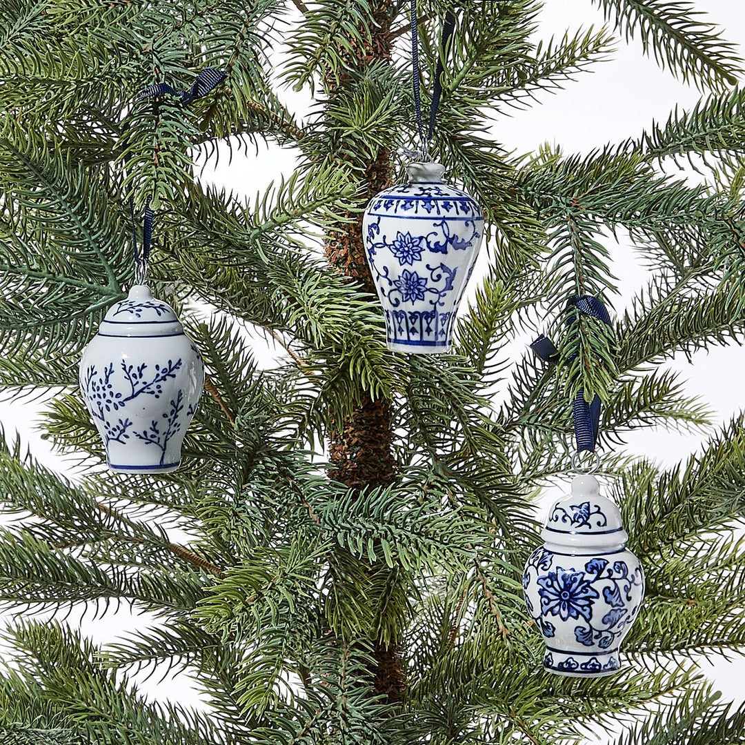 Blue and white ceramic ginger jar ornaments on a Christmas tree.