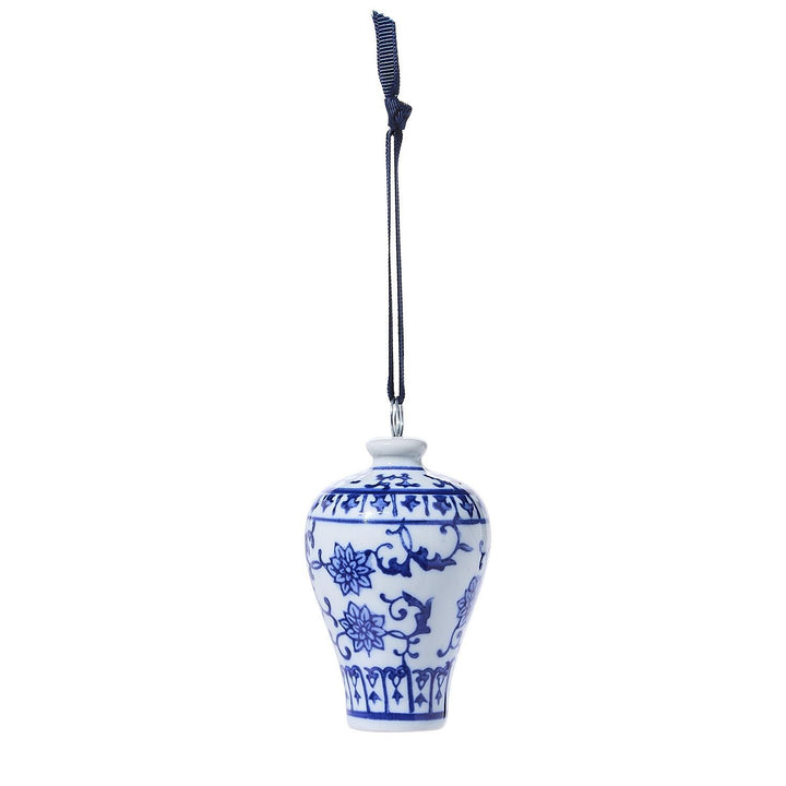 Blue and white ceramic hanging vase with floral patterns on a white background