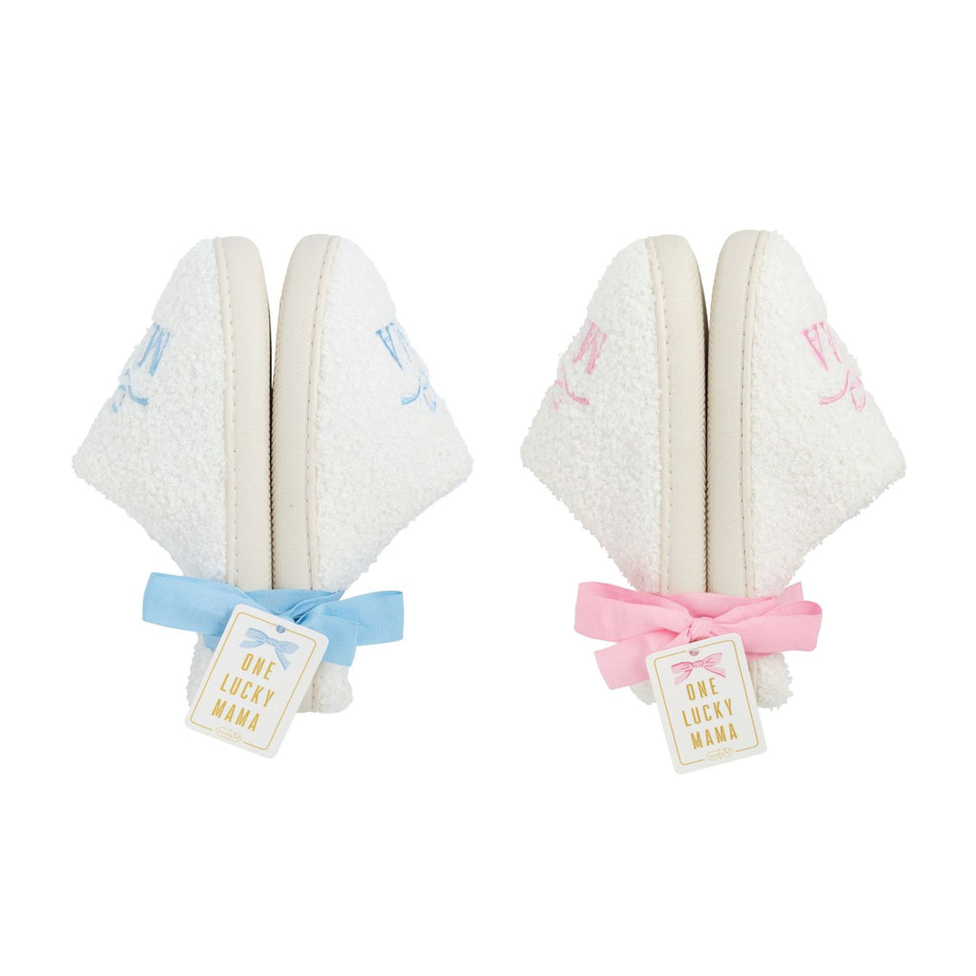 Two sets of slippers with ribbons and tags on a white background