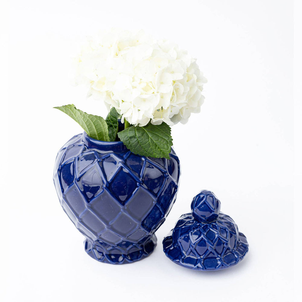 small navy ginger jar with lid off and hydrangea in ginger jar as vase
