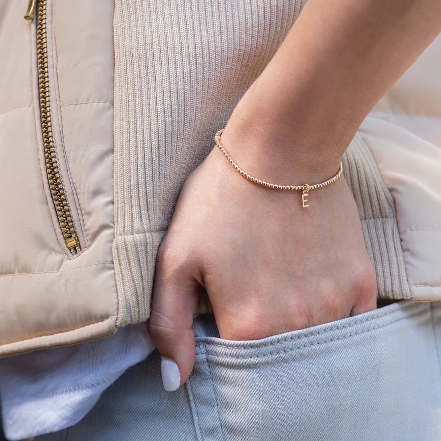 A beautiful, simple piece reminding us of who we are and to celebrate each other. Enjoy your own initial and those of whom you love.

Made with 2mm, 14kt gold-filled beads, 14kt gold-filled letter charm