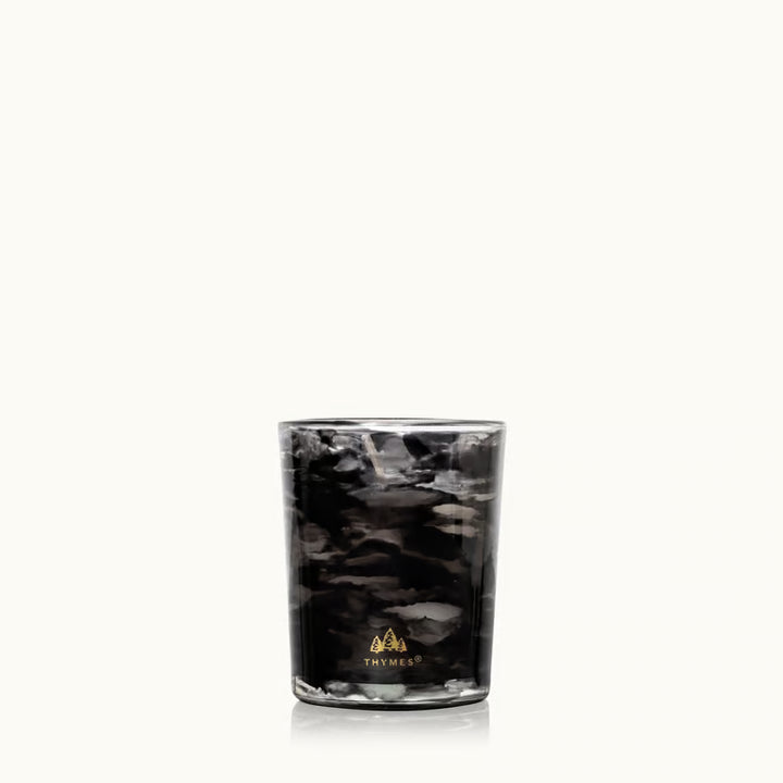 Noir Woods votive candle styled with smoky woodland accents