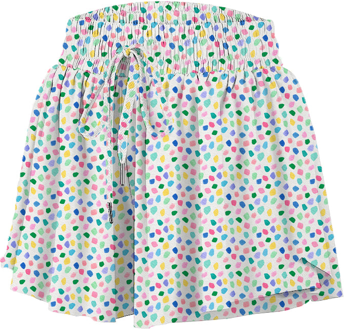 Childrens flowy allover multicolor confetti dot print shorts on white background